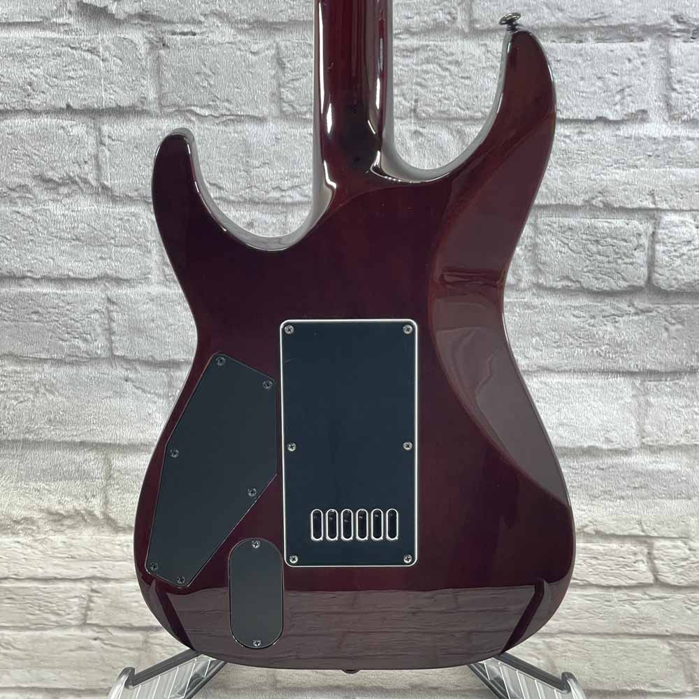 Used:  ESP LTD Deluxe MH-1000 Evertune Electric Guitar - Sunset