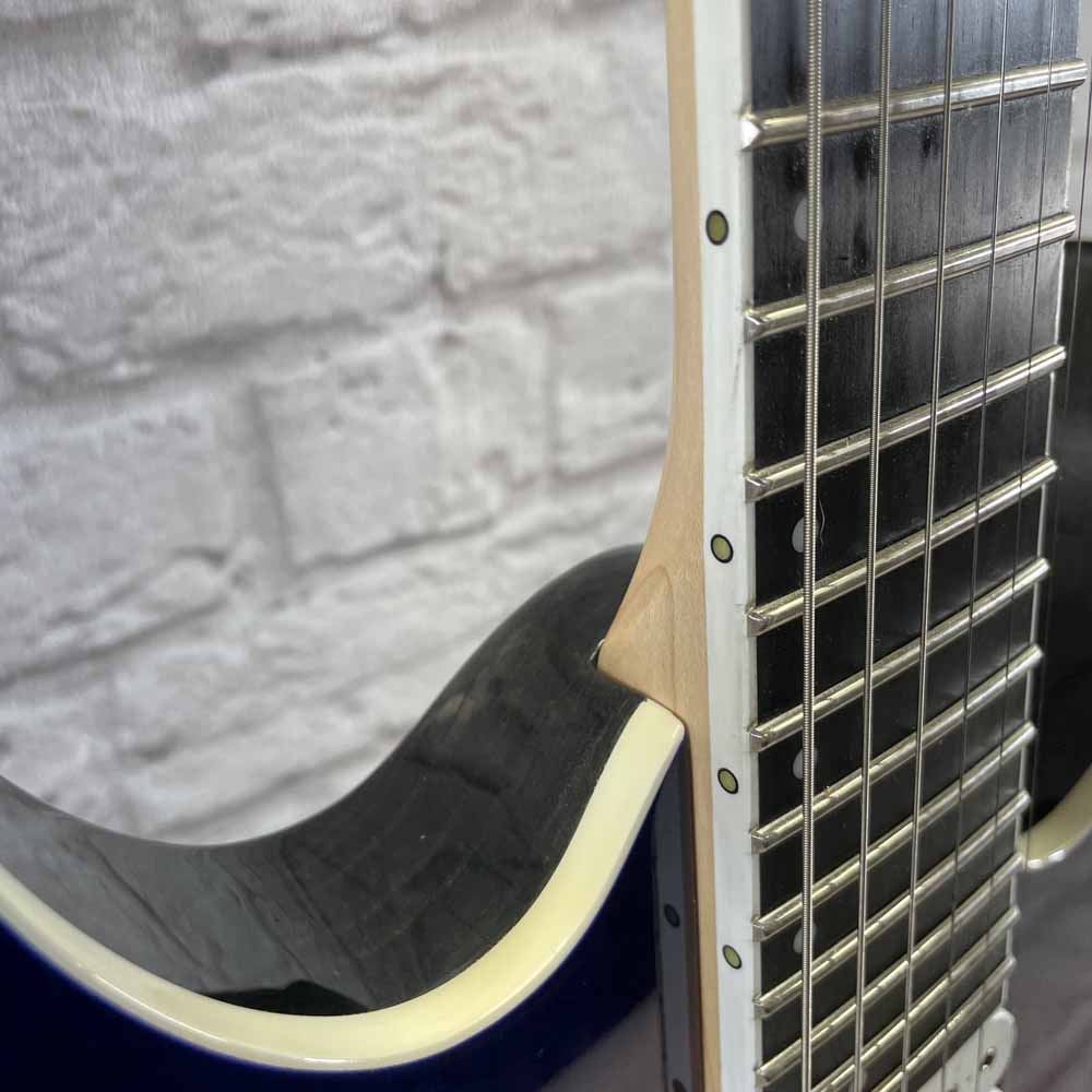 Used:  Ibanez RGIX6DLB-SNB Electric Guitar - Supernova Burst